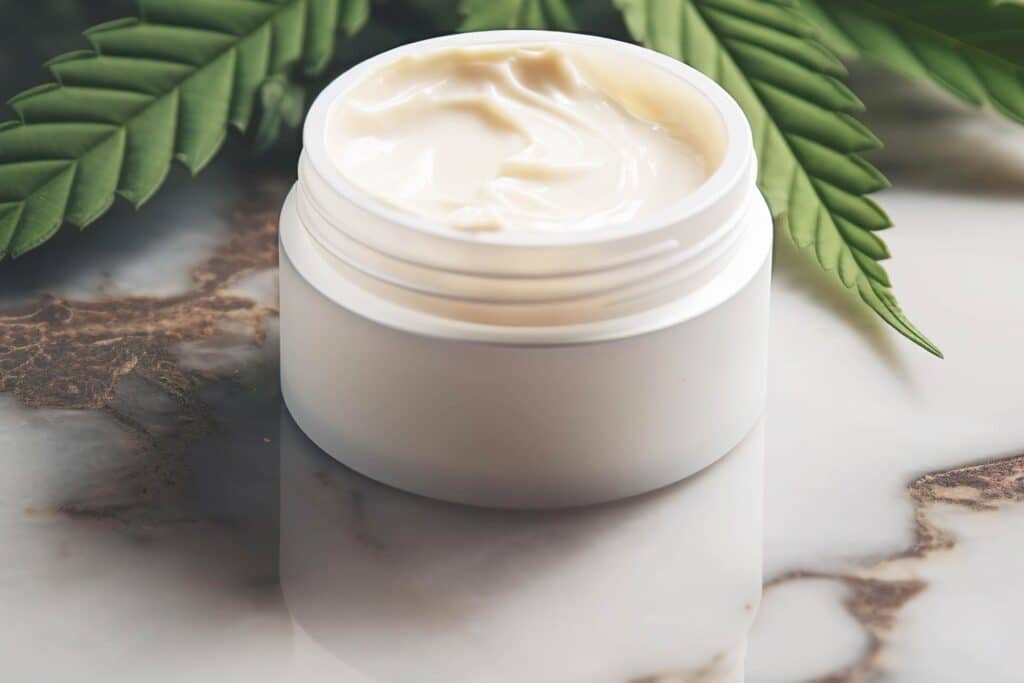 Cannabis Topical: THC Lotion in a jar infront of a cannabis leaf